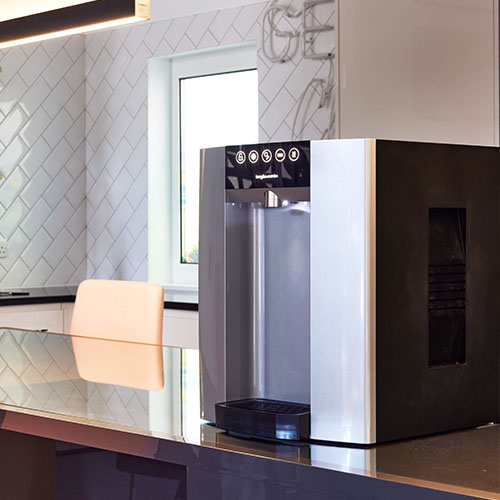 Active B&O E6 table top water cooler in an office environment