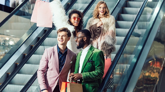 4 people on an escalator in a shopping centre