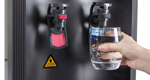 A mains fed water cooler dispensing water