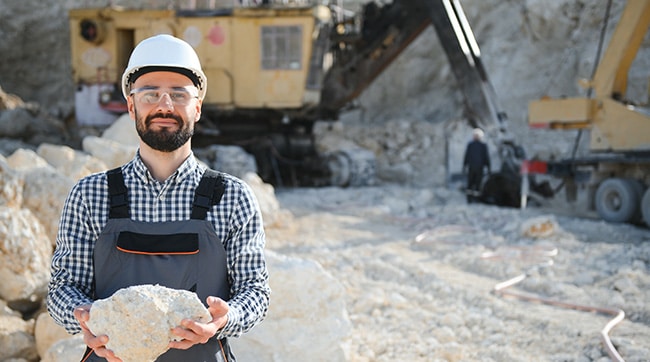 worker holding limestone, representing the town of Tadcaster, North Yorkshire.
